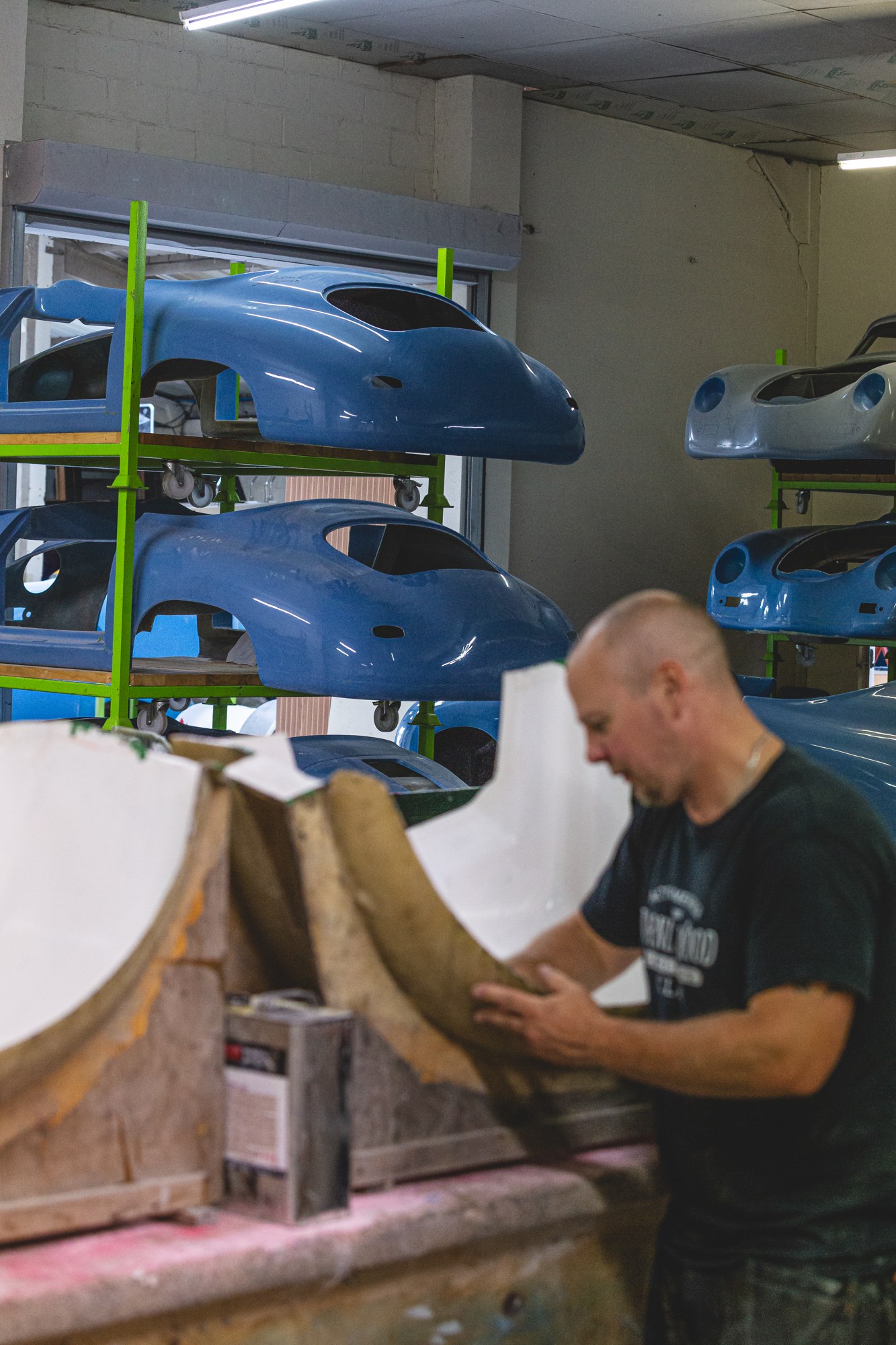 A Sebring craftsman hand-finishing a bespoke composite component